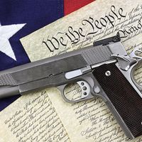 Handgun on top of the U.S. Constitution